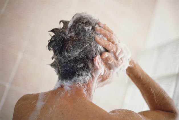 Man Washing Hair in Shower