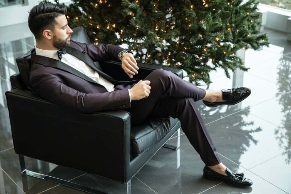 Man Dressed in Tuxedo Looking at Watch