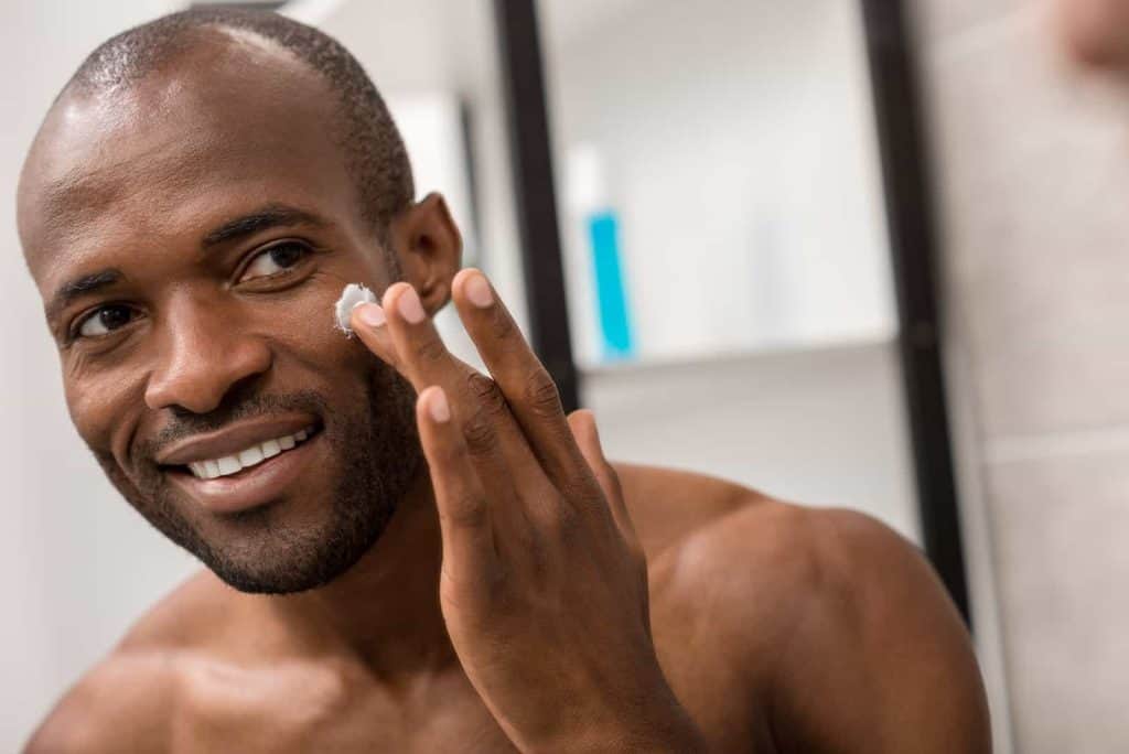 Man Applying Moisturizer