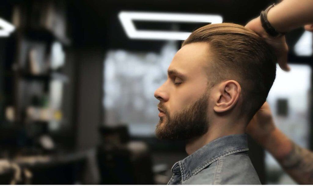 Man Getting Hair Styled In Salon