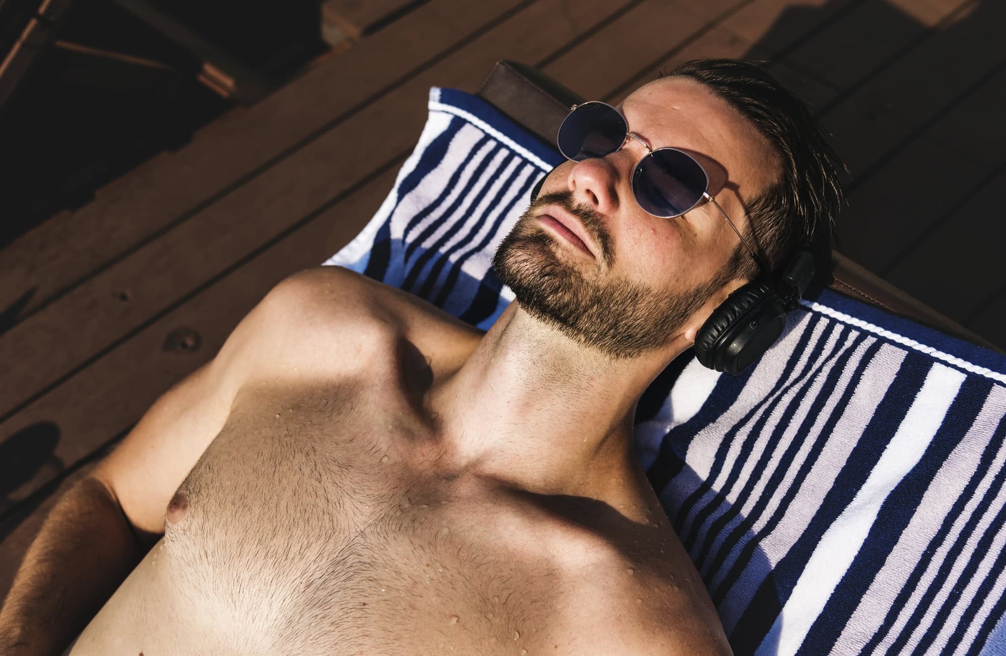 Man with Short Hair Enjoying the Summer By the Pool